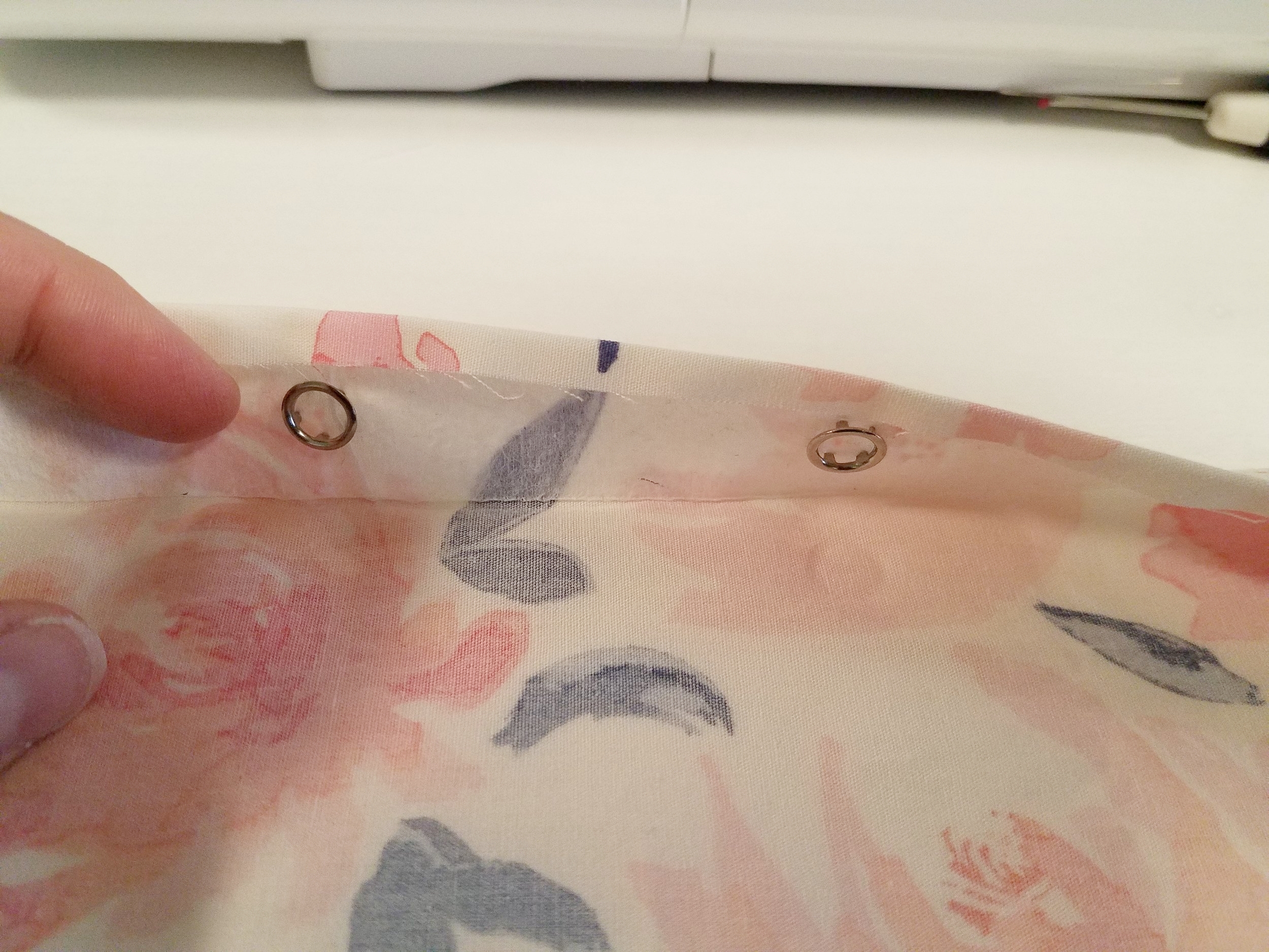 Set the snaps inside the interfaced placket, instead of through all the placket layers.