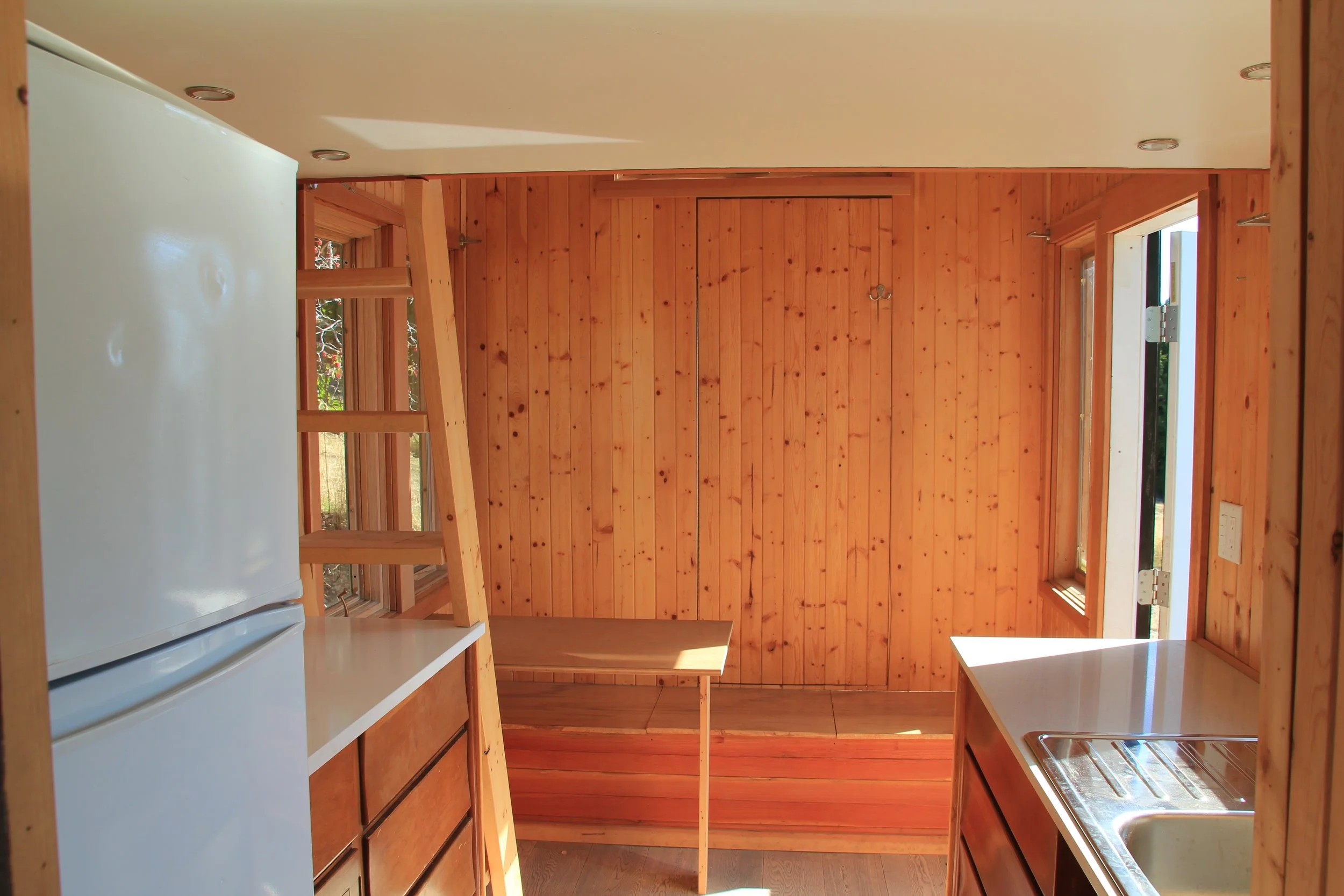 Looking back from the bathroom, you've got a good view of the "almost secret closet" for hiding tall and bulky stuff (like brooms and snowboards).