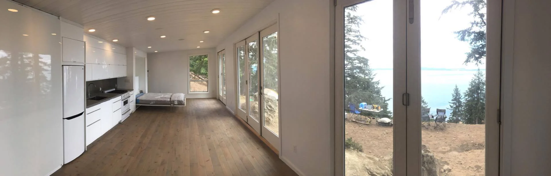 Open plan, off-grid cabin on a Gulf Island in British Columbia, Canada. 