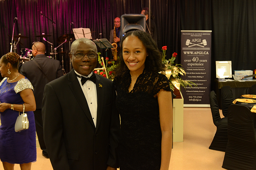 Barbados consul general Haynesley Benn presented a Club Carib scholarship to Garielle Chen