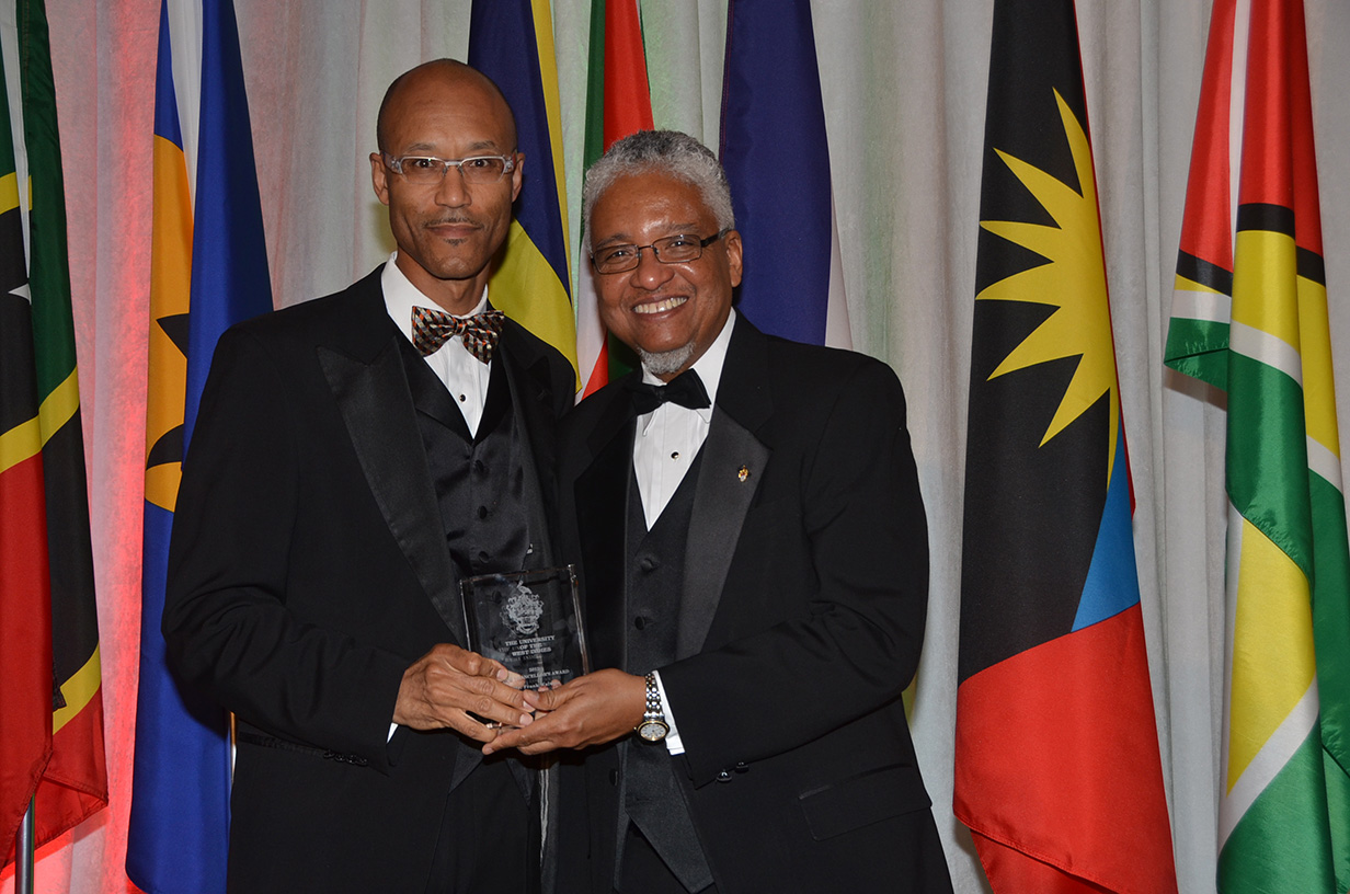 Frank Walwyn receives vice-chancellor award from Dr. Nigel Harris