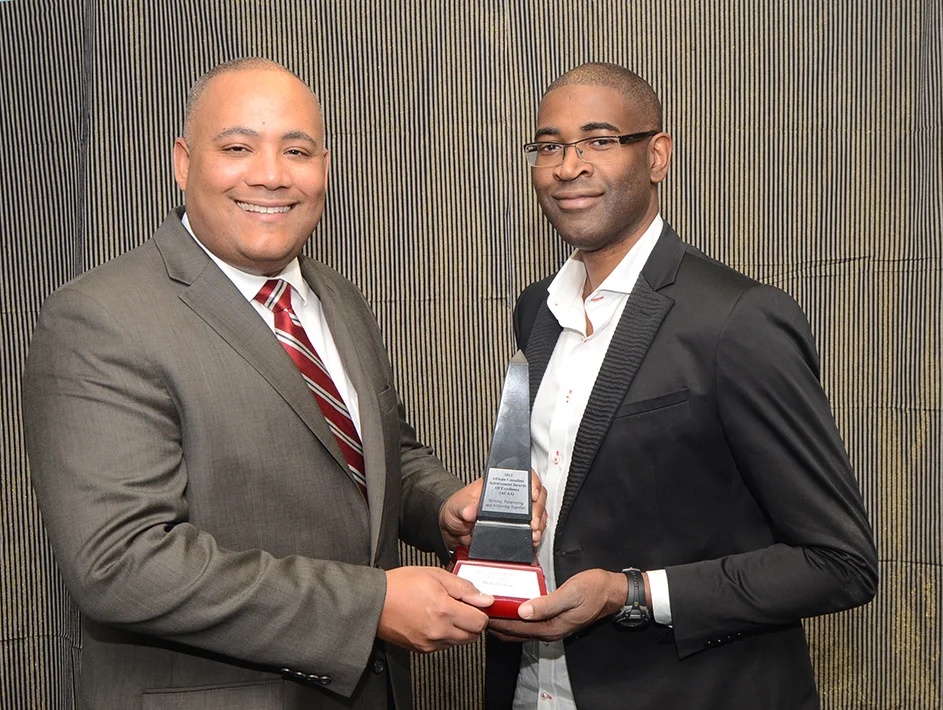 Sudz Sutherland presents the ACHA to Michael Coteau