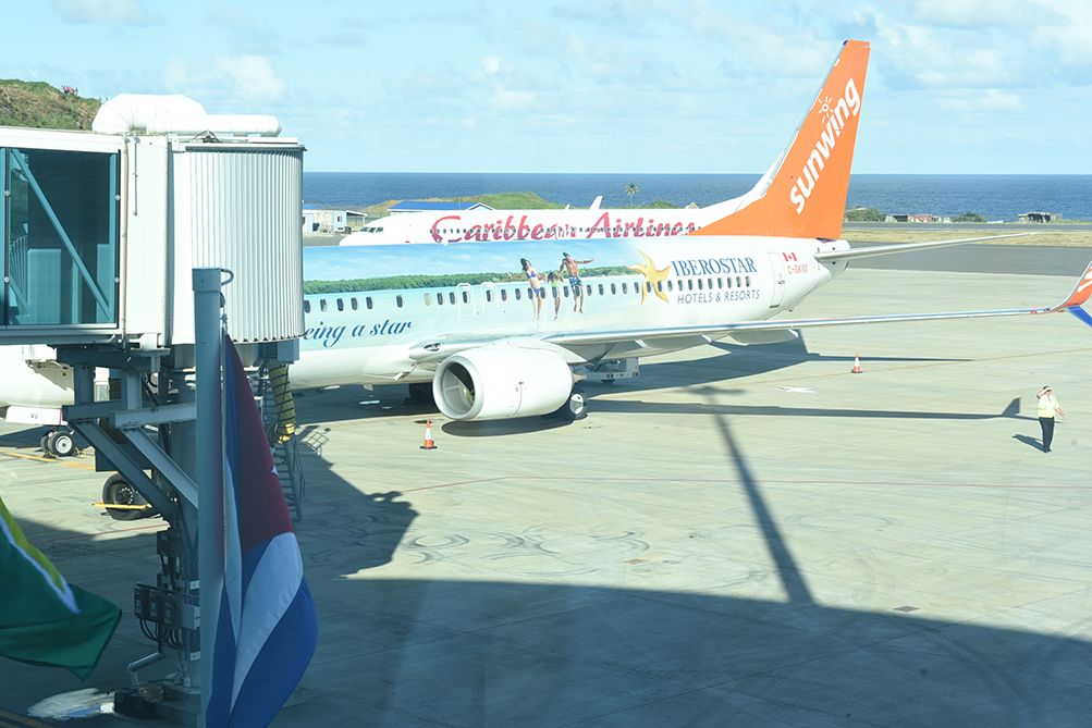 Sunwing and Caribbean Airlines inaugural flights at jet bridges