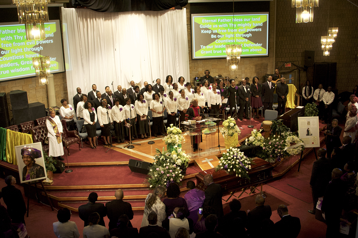 Rev. Dr. Audley James conducts the service at Walker's funeral