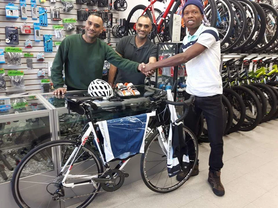 Twins Rick and Rob Din presented Walter Grant-Stuart with a new bike and accessories