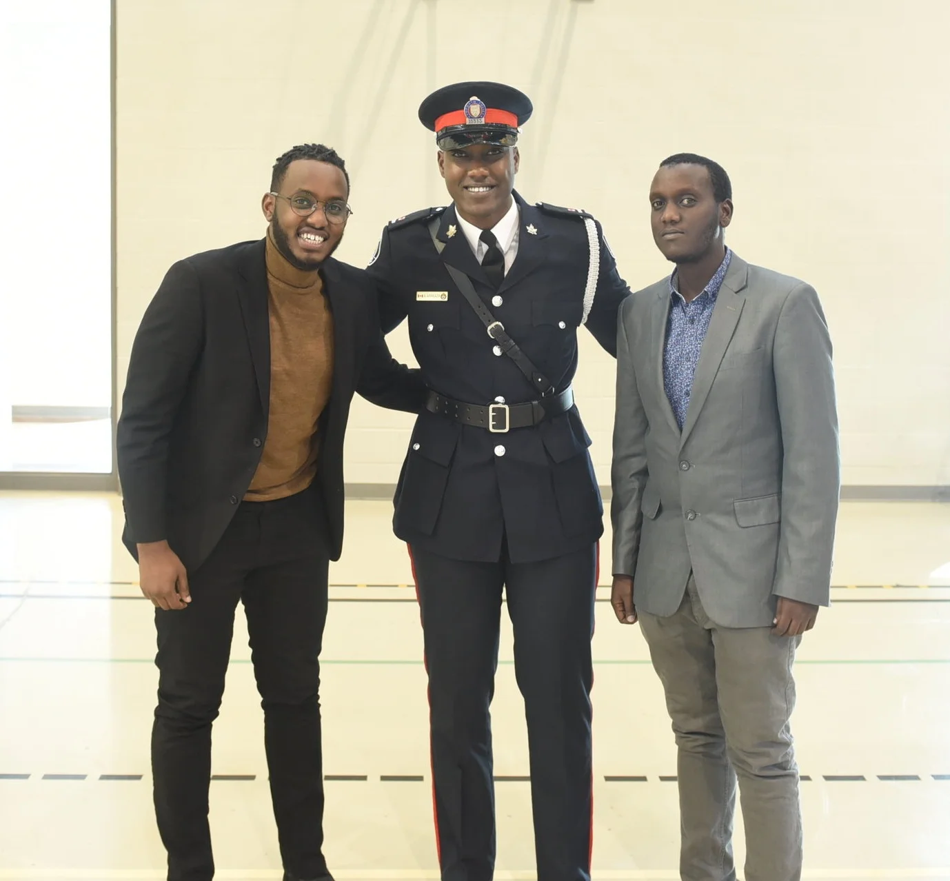 Const. Alain Arakaza with siblings Camille Kamanzi (l) & Igor Gahizi