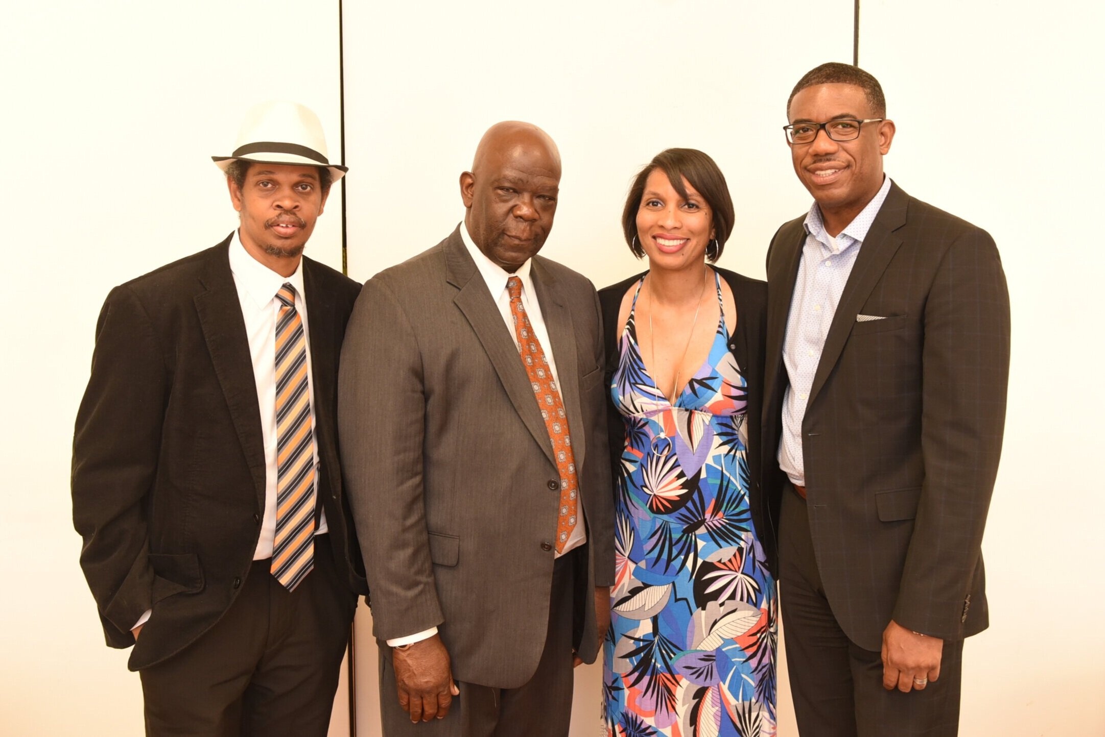Curtis Ennis (r) with then Africentric Alternative School Principal Luther Brown (second from left), Vice-Principal Lanya Lewis and Parent Council Co-Chair Paul Osbourne at the Africentric school graduation in July 2018 (Photo by Ron Fanfair)