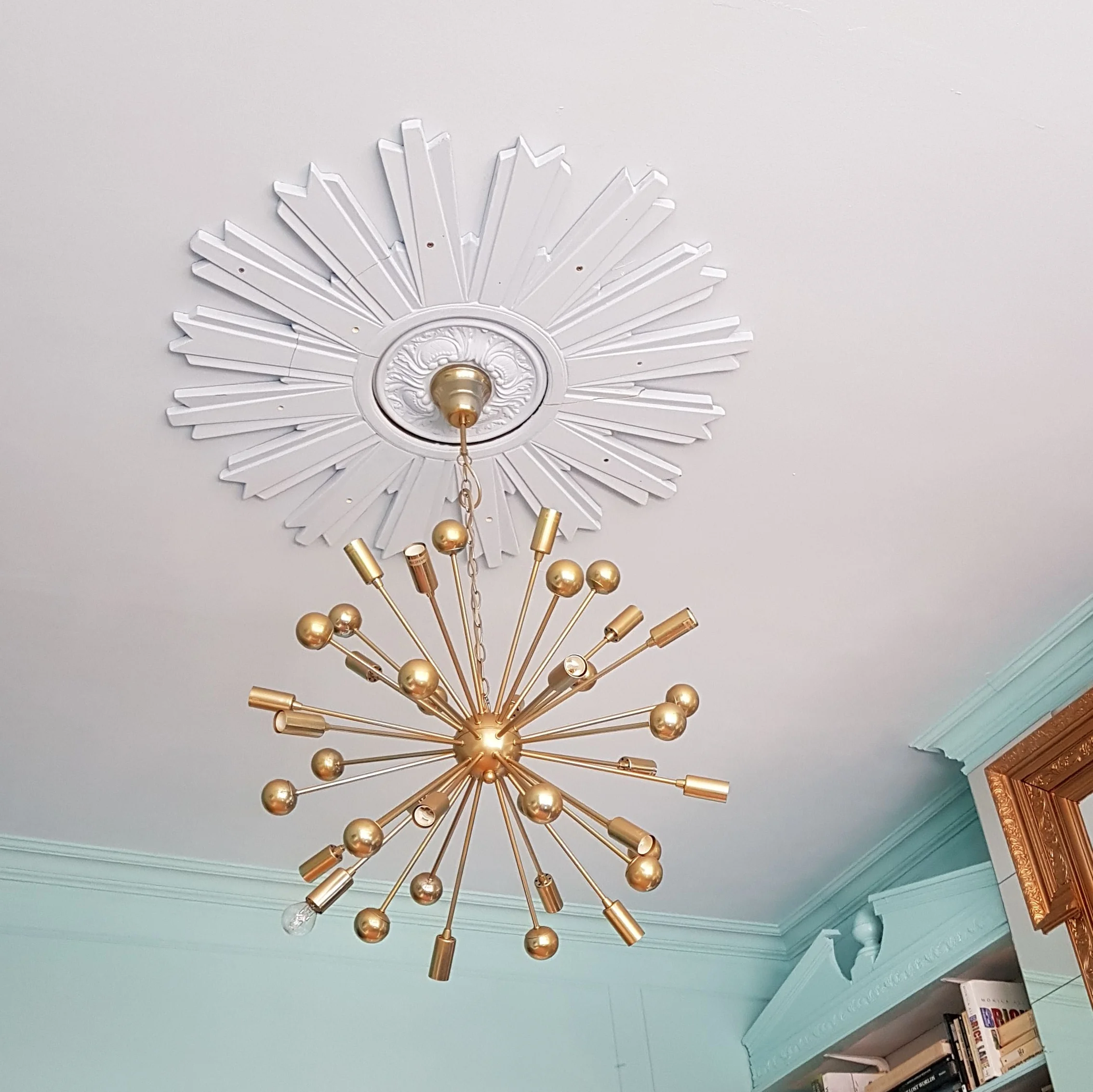 Here you can see both of the paint colours side by side and my ahem "bespoke" ...ceiling rose all painted out in the same colour as the ceiling, working its magic.