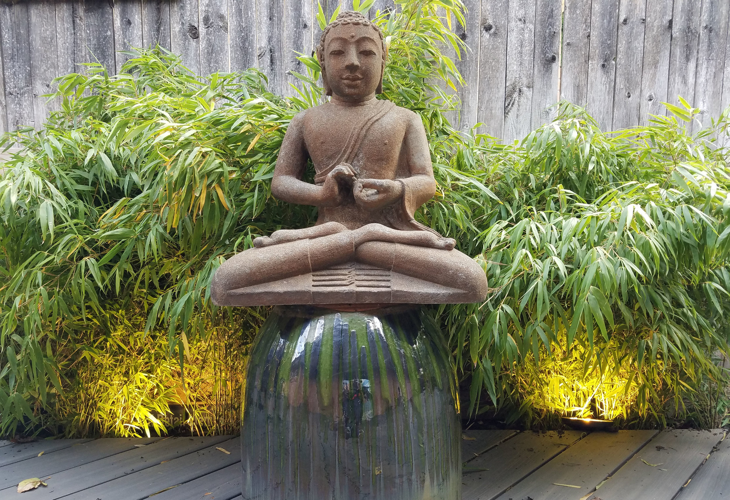 A BUDDHA STATUE PROVIDES A POINT OF FOCUS IN THE LOUNGE AREA