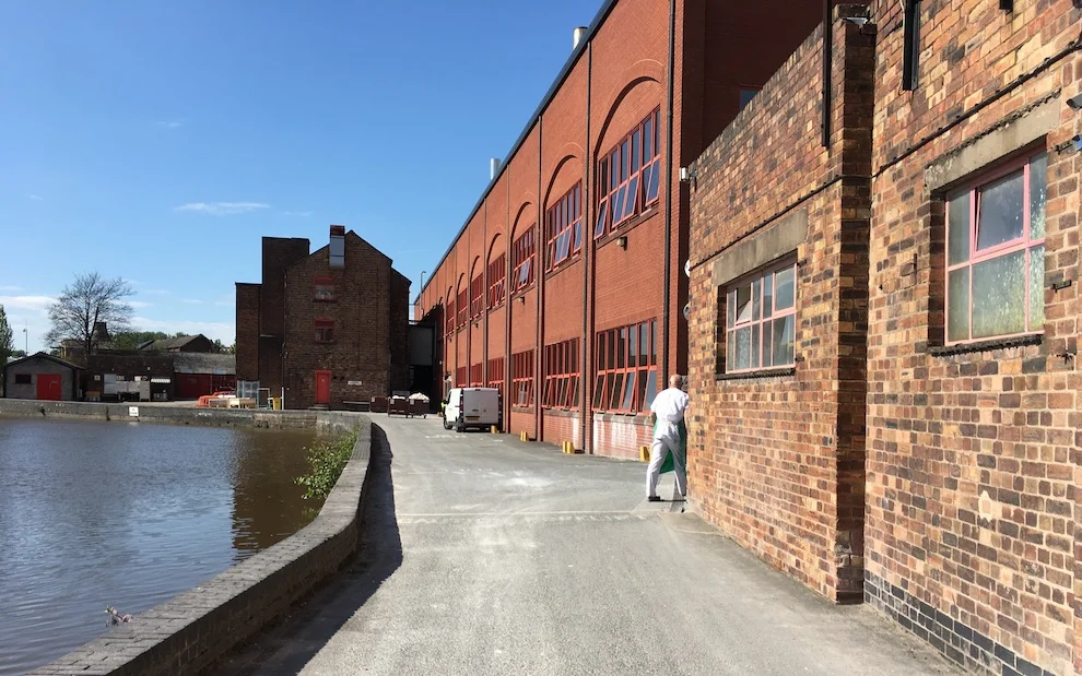 A canal runs through the middle of the factory grounds