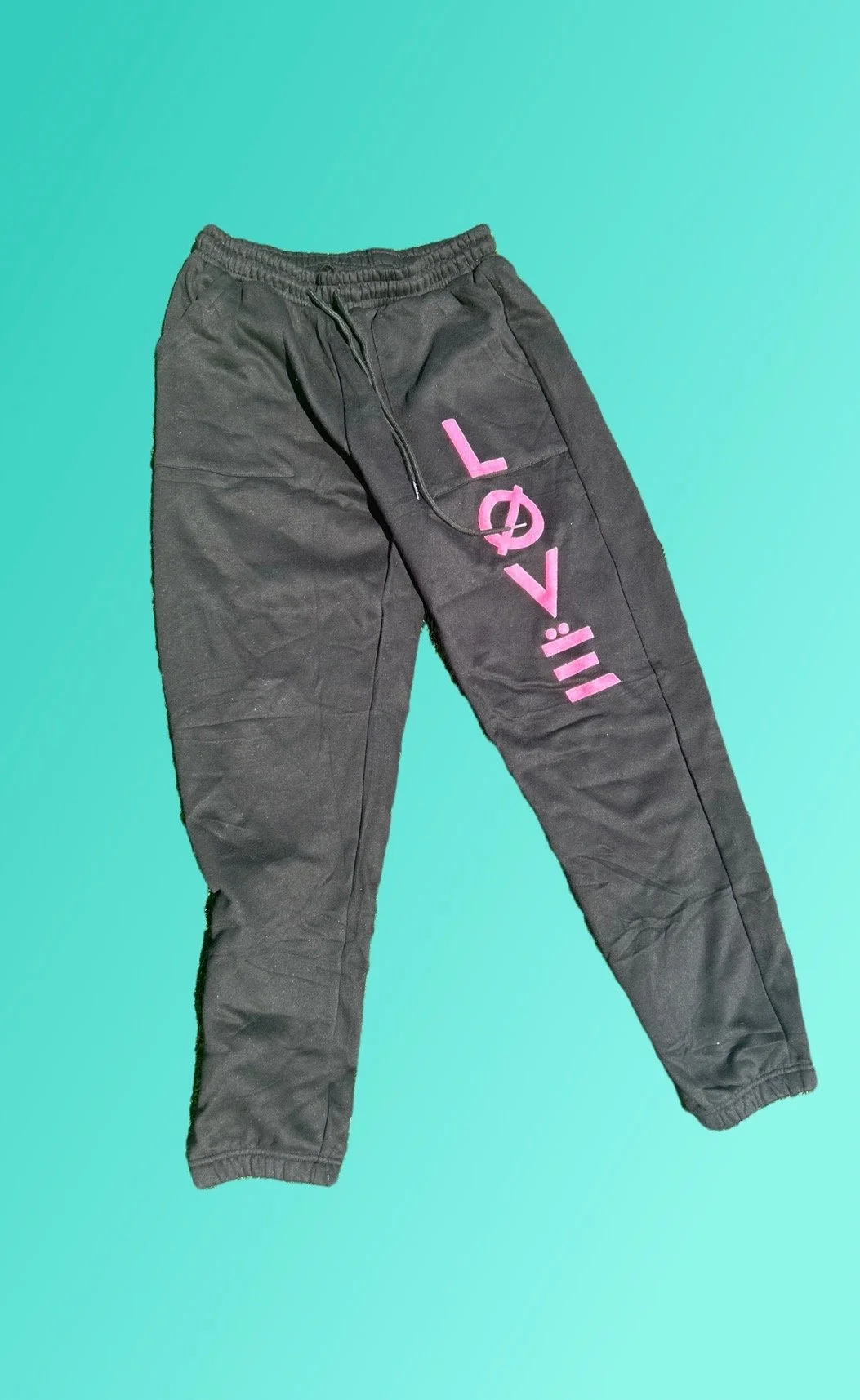 Black joggers with pink love logo