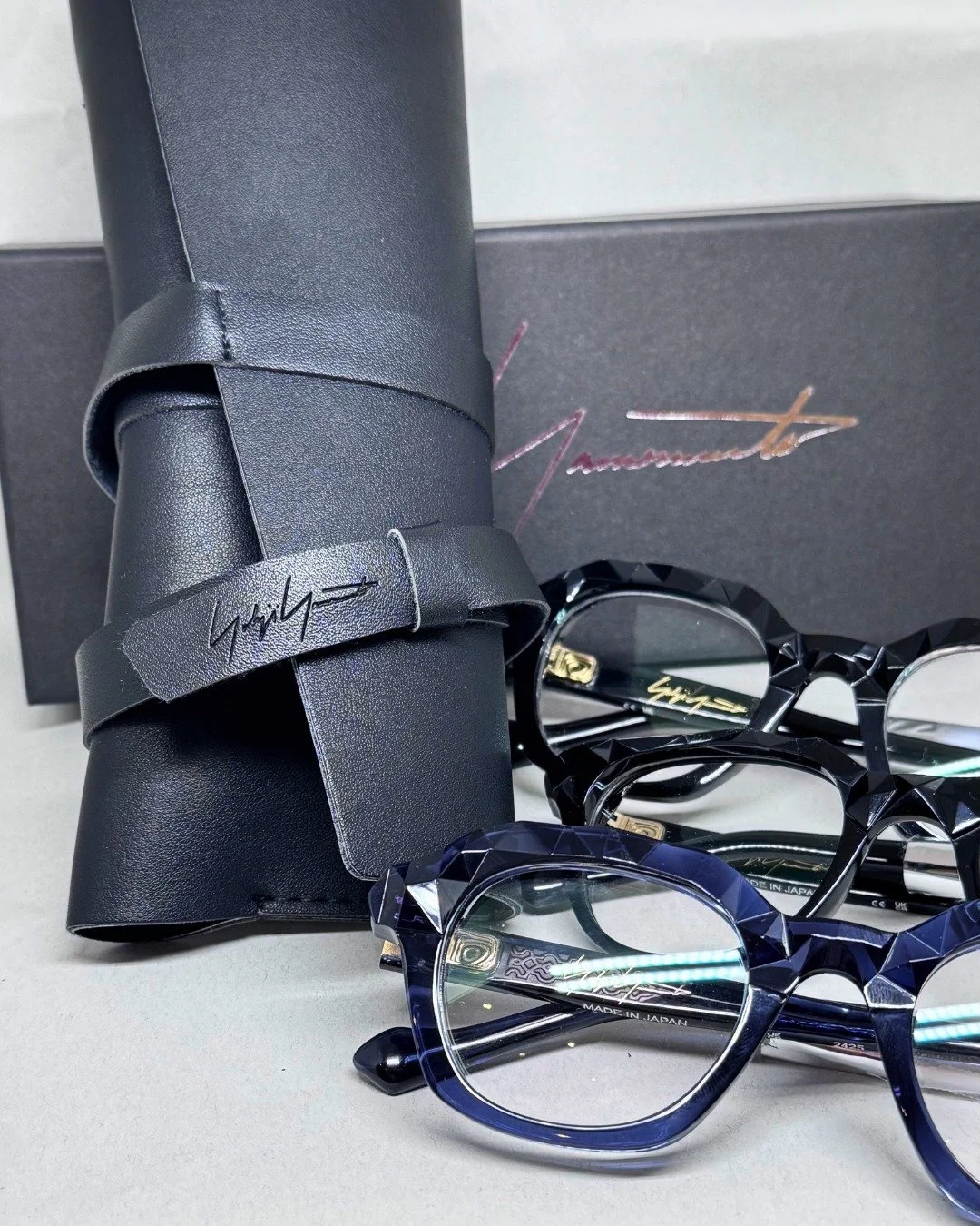 The navy one. That's the frame people ask about.

Yohji Yamamoto geometric acetate &mdash; Made in Japan.

The layered navy runs through the acetate in a way that changes in different light. Some angles it reads almost black. Others, the blue comes t