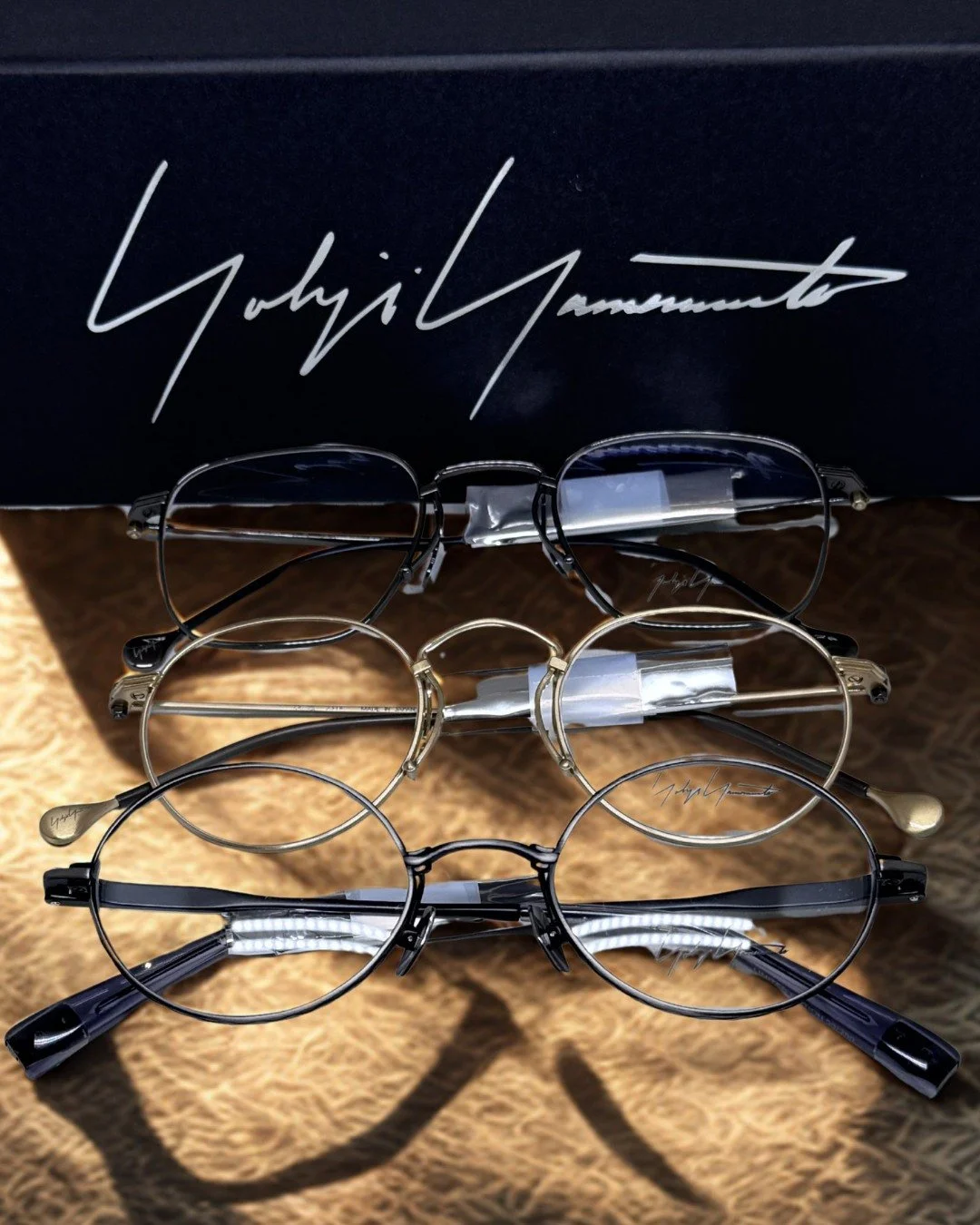Three new @yohjiyamamotoeyewear frames just arrived at KIMS Optical &mdash; and they arrived together for a reason.

The semi-rimless gunmetal at the top: minimal, precise, the choice of the person who wants their eyewear to be present without announ