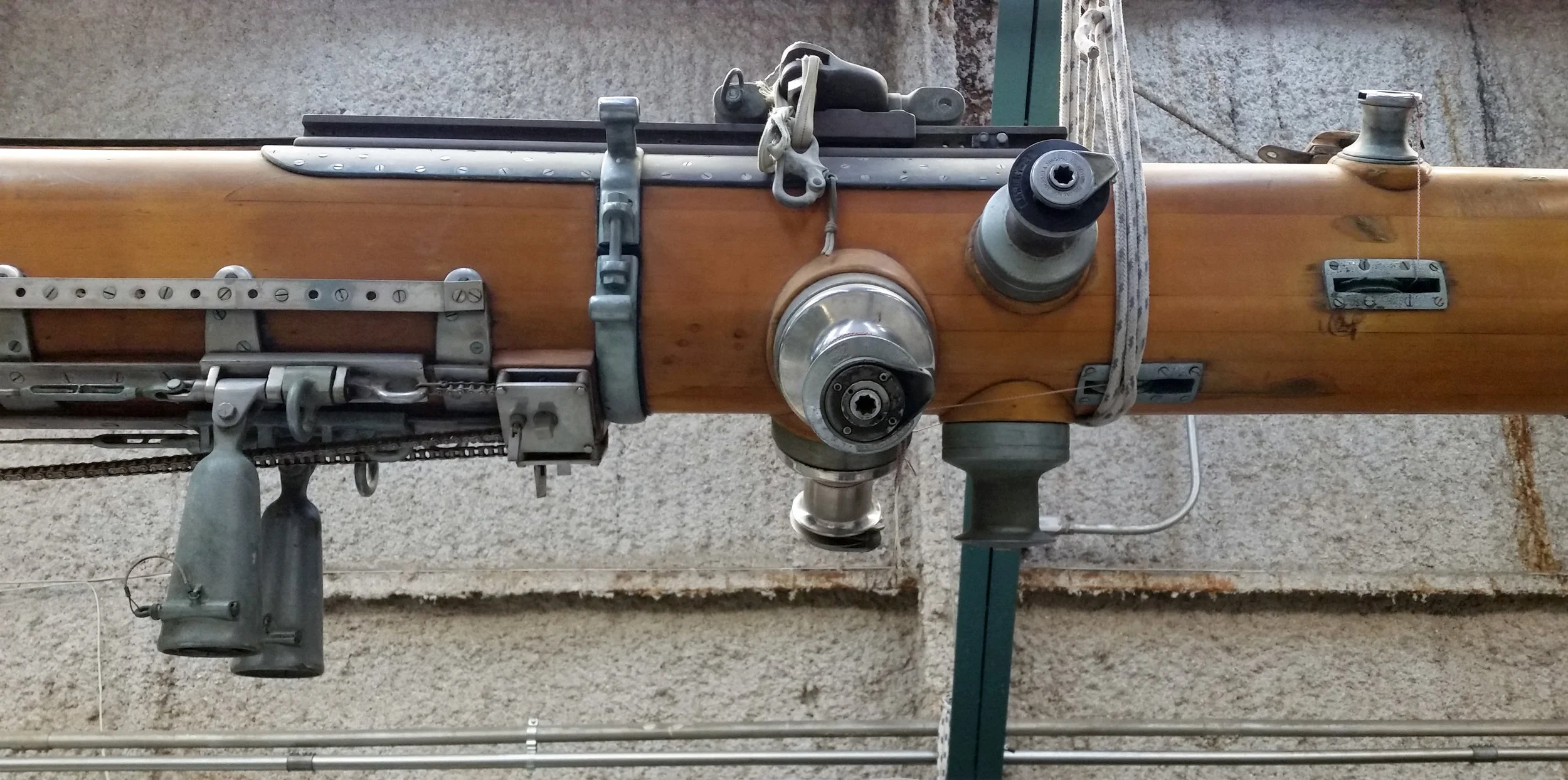 Her masts and boom parts were removed and have been stored indoors for safekeeping. Escapade was among the first sailing yawls to have her halyards and control lines run inside, as opposed to outside, the wooden mast.