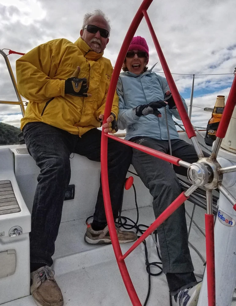 P osing for shots on a solid heel in Carquinez Straits. Whispering sweet nothings into a skipper's ear can be one of the best ways to ensure good communication and coordination when trimming. Oh, and that is NOT my beer.