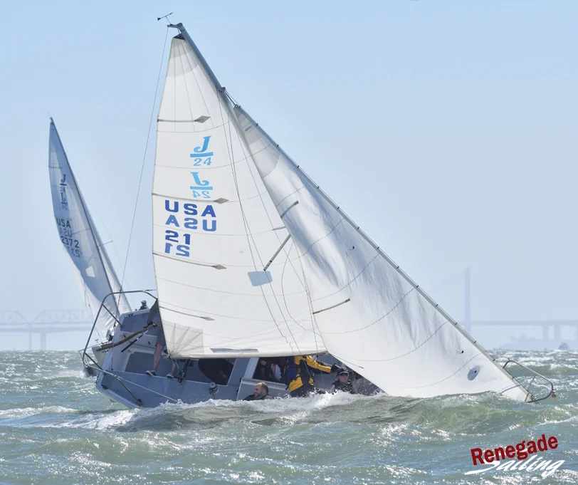 Smiles all around if you look closely. This is San Francisco Bay, November and the water is still 57-degrees. Boat number altered to protect the innocent.