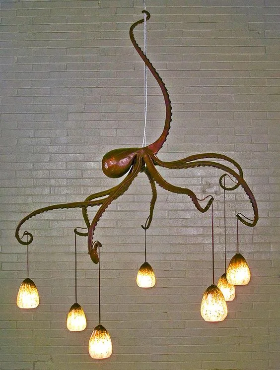 A great example of 8-armed lighting. We could not identify the maker, but you can search via “find similar images.”