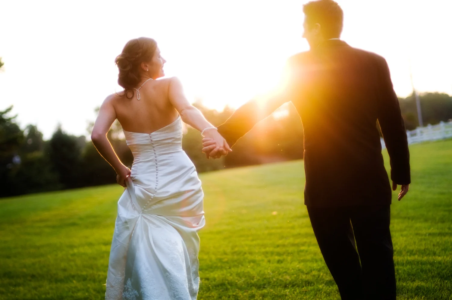 wedding_bride_groom_sunset_walking.jpg