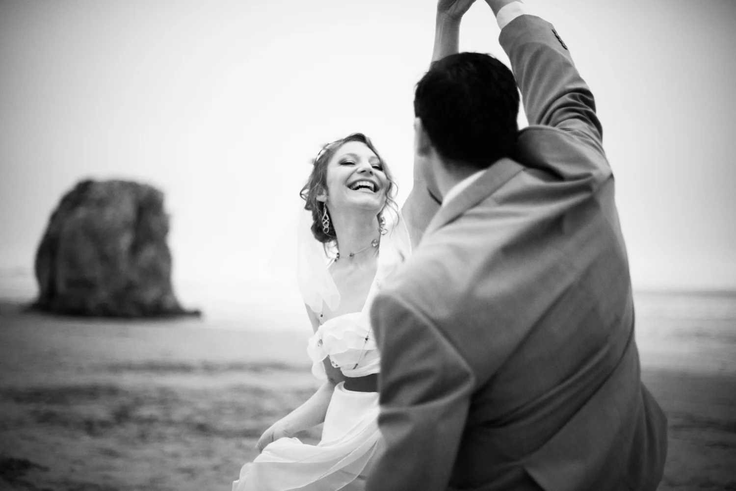 wedding_portrait_beach_bride_laughing.jpg