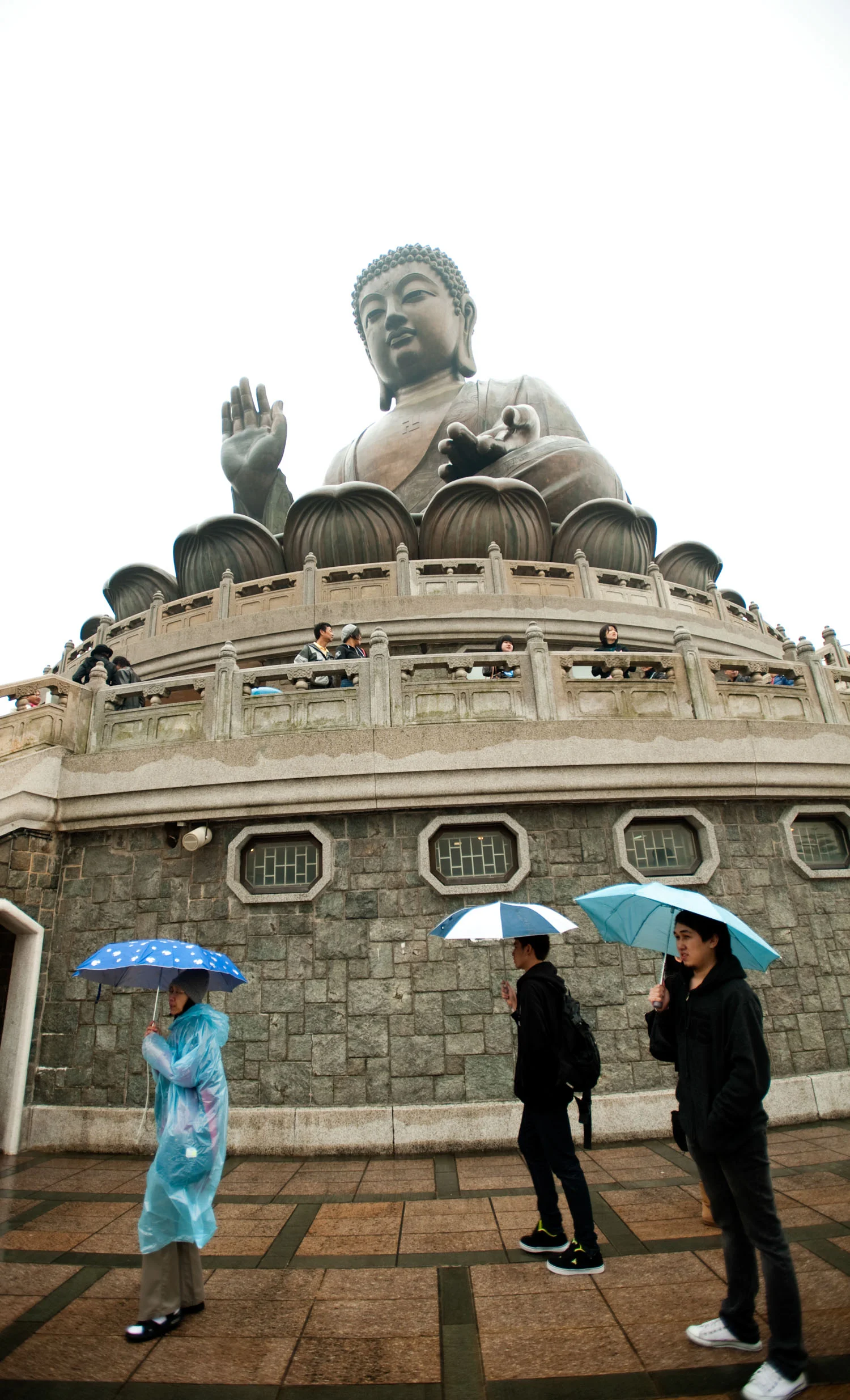 asia_travel_budda_rain_umbrellas.jpg