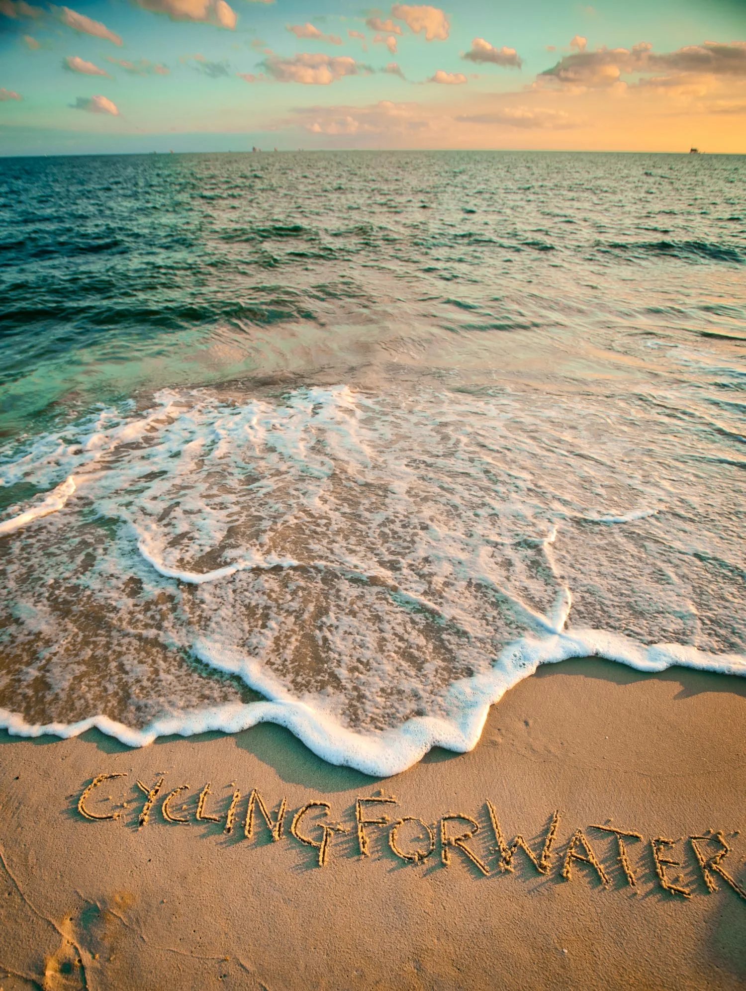 cycling_for_water_ocean_words_sand.jpg