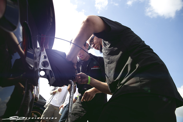 Clem and Gabe strapping the parachute back up after each 200+ mph pass.