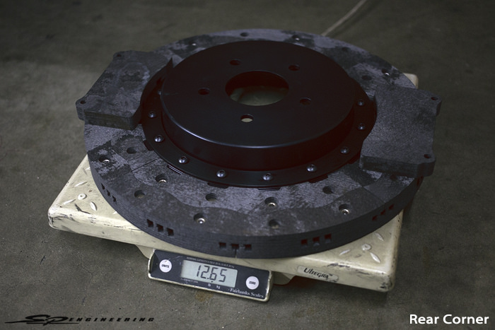 Weight comparison between steel rotors and carbon-carbon rotors. So much weight shed in each corner. Very racing. Wow.