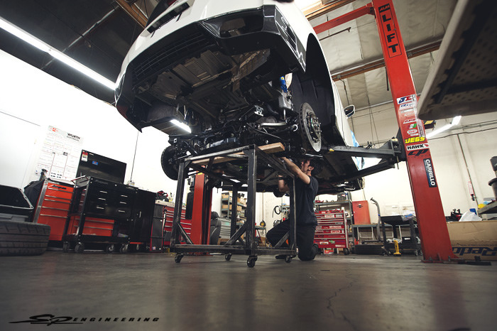 Once the engine was bolted up in place with everything hooked up, the rear subframe and transmission went up soon after.