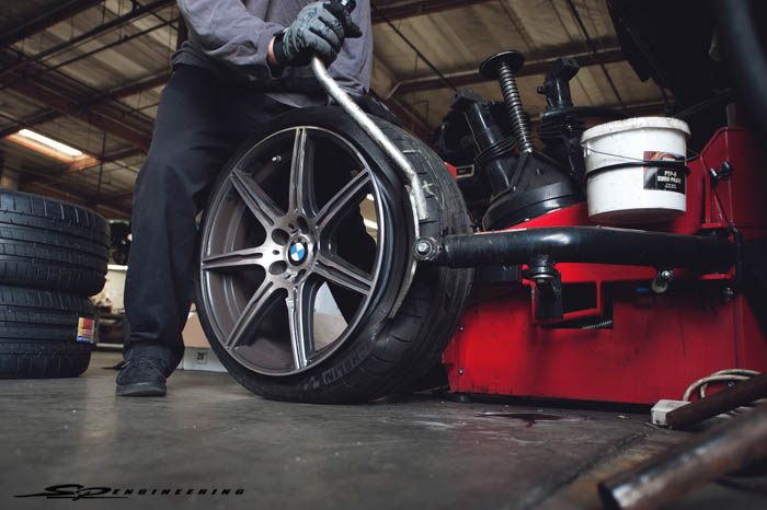 Here you will see our technician unbeading the factory tire to take off the TPMS’ to use for the new Forgestar’s.