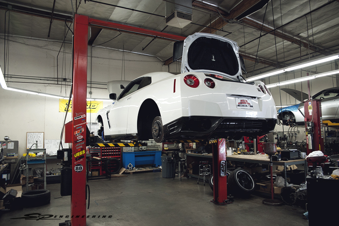 The Track Edition includes items that the Black Edition has, plus more. The 3 main additions to the Track Edition is the front carbon fiber air dam with air/brake ducts, blue/gray leather-appointed front seats, rear seat delete that is replaced by a diamond stitched cover and the Track-Tuned suspension.