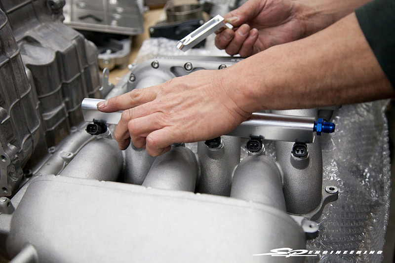 The SPE Spec Greddy Intake Manifold holds an additional custom tapped fuel rail to provide the amount of fuel needed for all the power: specifically 3000cc in each cylinder. This is vital as being tuned on Ethanol requires an average of 30% more fuel than regular gasoline.