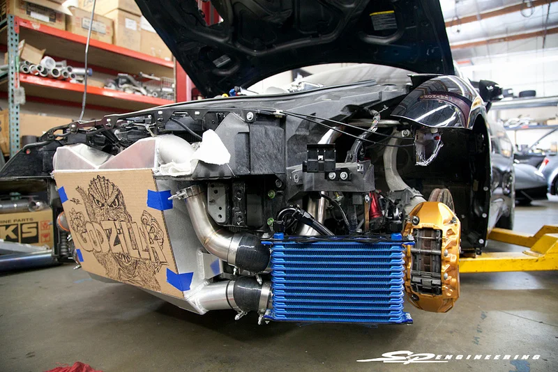All this added power creates some seriously high temperature numbers for the motor and transmission, so our SPE Spec ETS Race Intercooler System is installed (Godzilla Art not included) to provide even greater cooling.