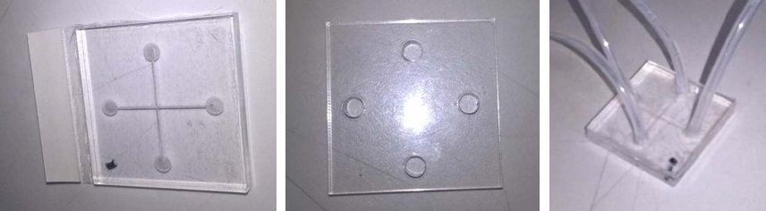 Figure 5: Prototype laser cut microfluidic chip, showing bottom and top pieces of 5mm acrylic cut separately and assembled with tubing (left to right).