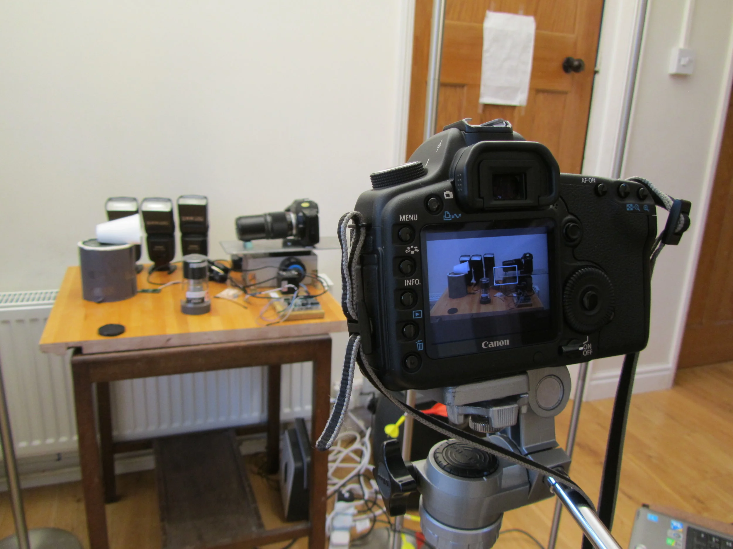 The DSLR filming the focus stacking setup, with decoy camera body in place