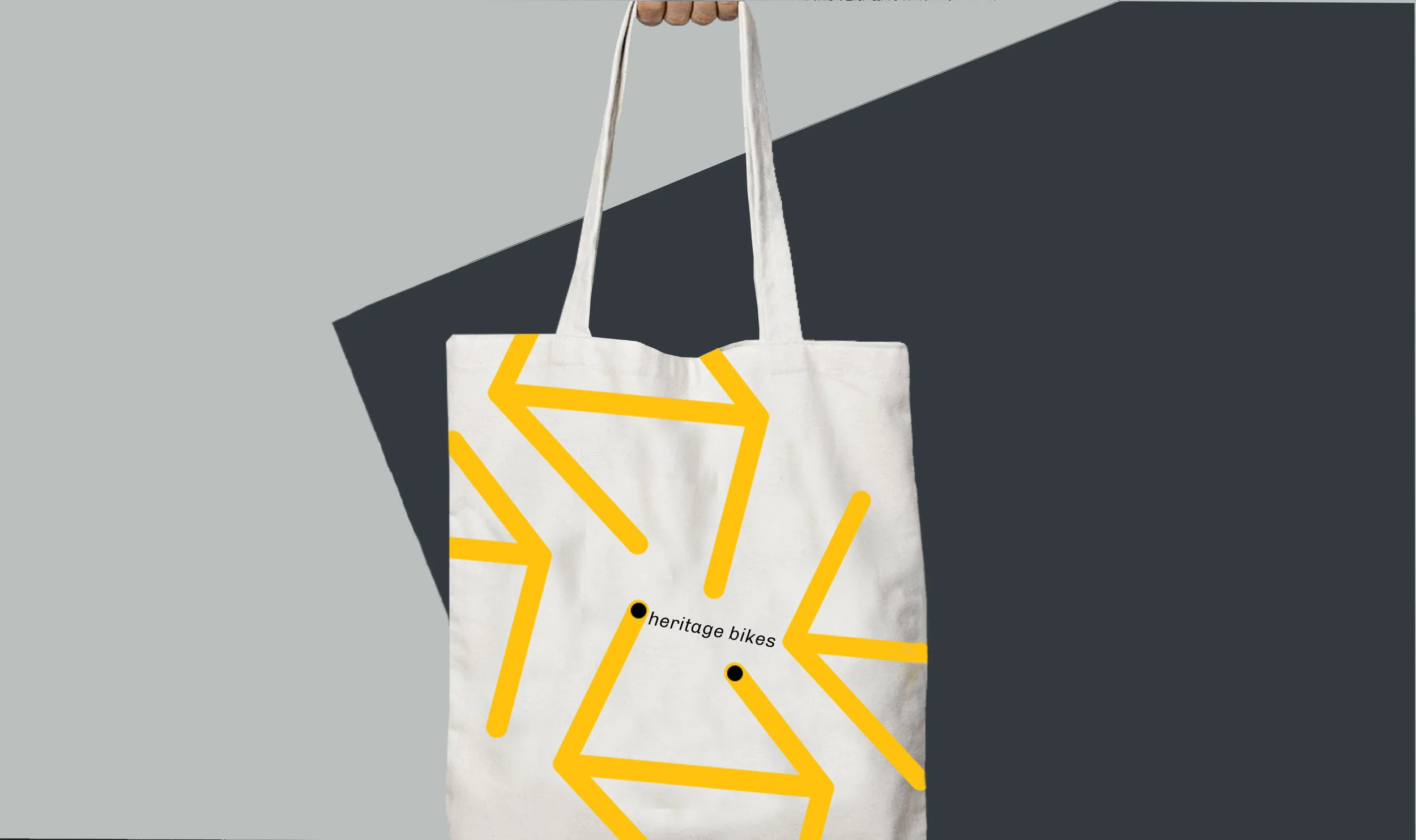 This tote bag is a playful interpretation of the logo mark as location points. 