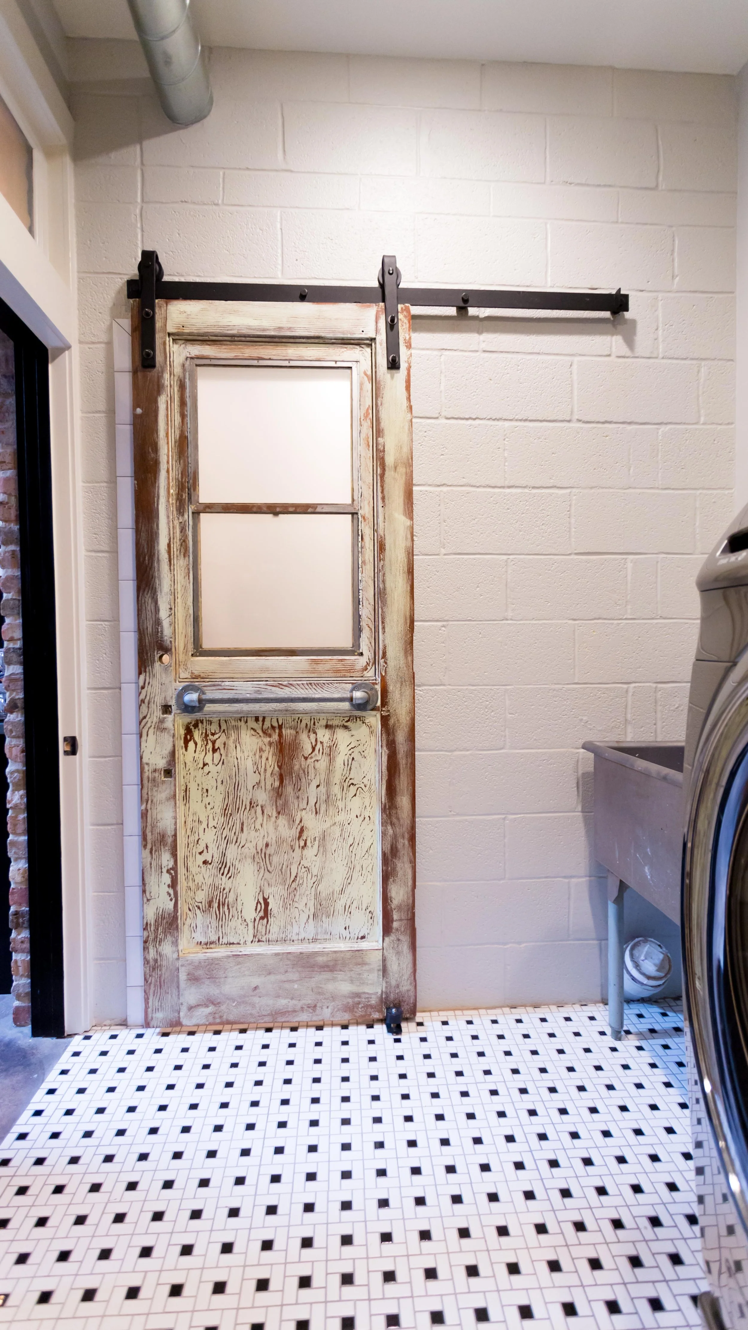Salvaged doors on barn slider hardware
