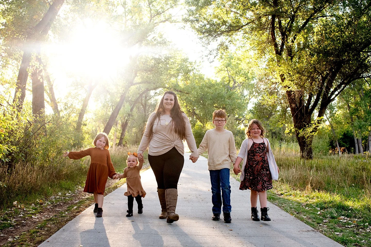 Family walking toward camera pose
