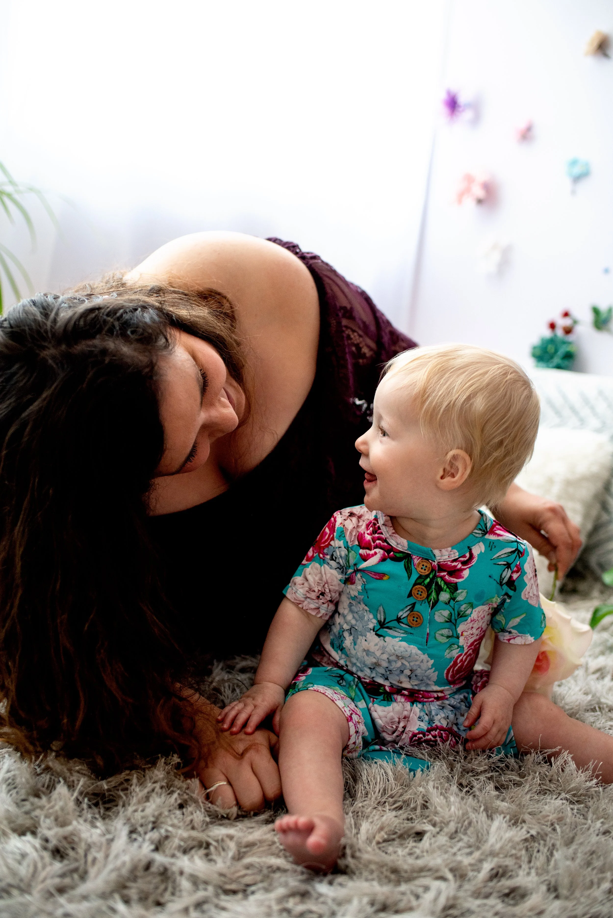 Mom and baby share a happy laugh