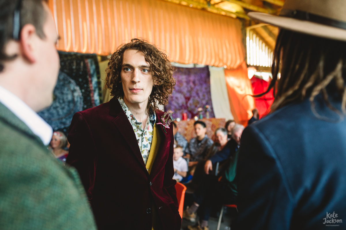 Groom in a fun burgundy velvet suit at festival wedding in Knockengorroch | Kate Jackson Photography