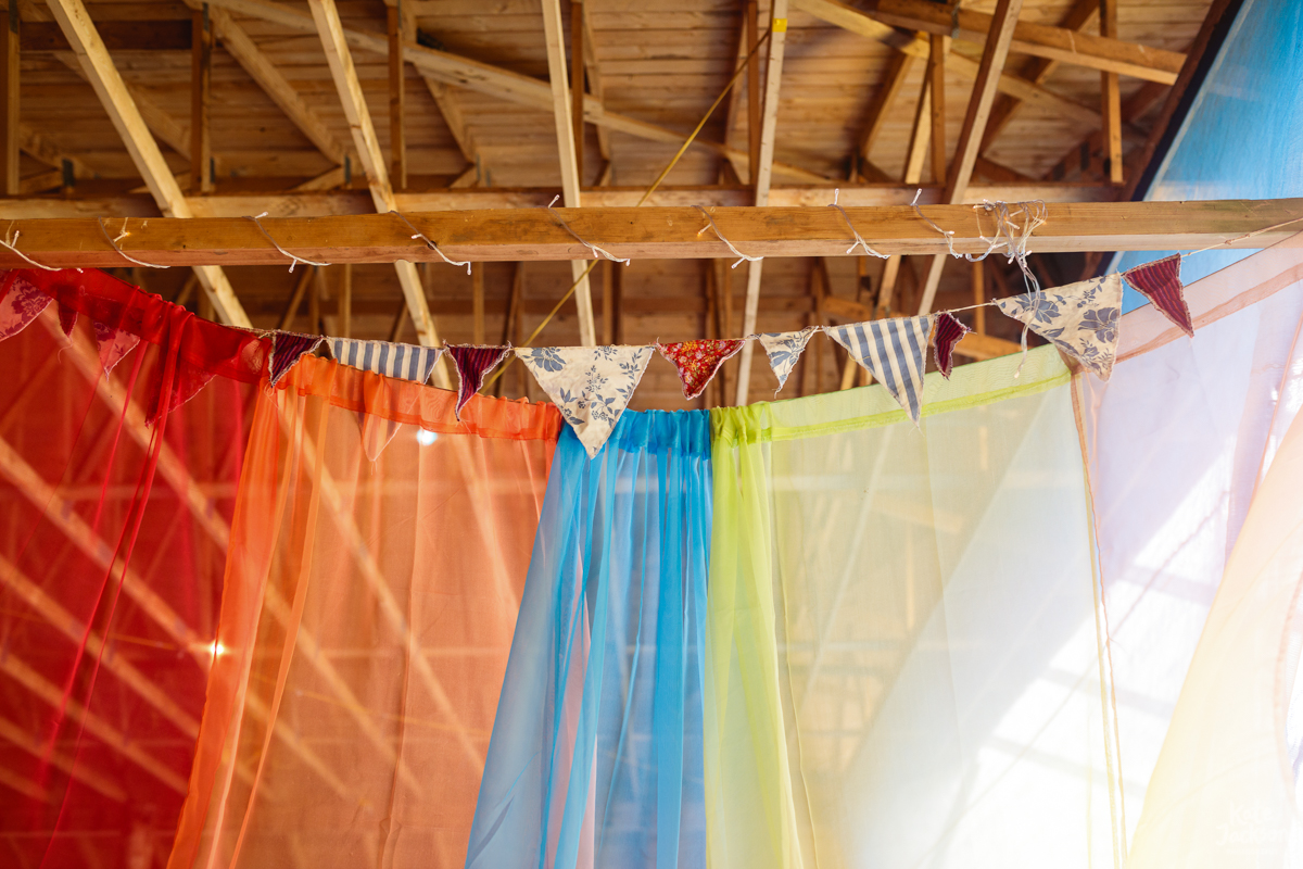 Rainbow Decor at DIY Festival Wedding in a Rustic Barn | Kate Jackson Photography