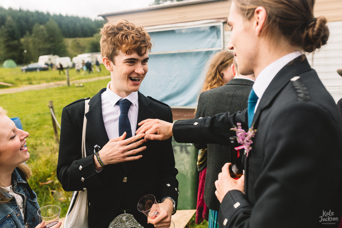 Kilts at alternative festival wedding in Scotland