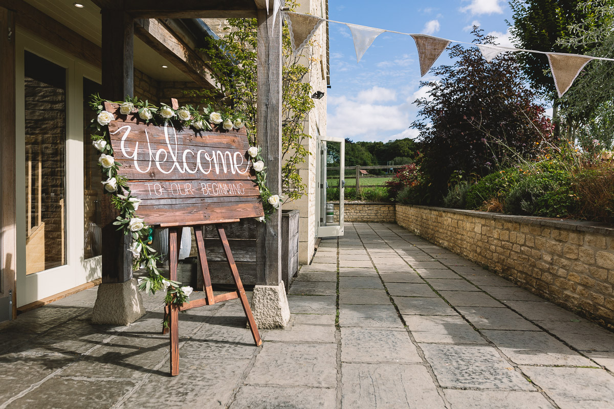 Hyde Barn Wedding Rustic Signage with Flowers