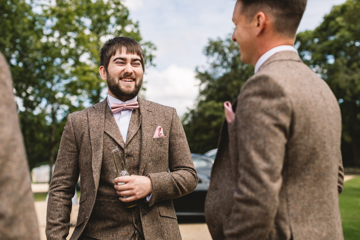 Groom Laughing and having fun at Hyde Barn Wedding