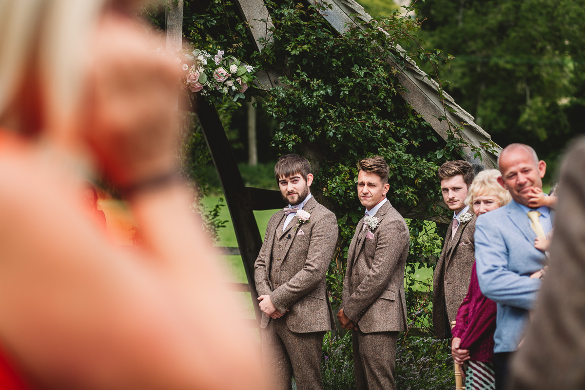 Groom first look at relaxed outdoor hyde barn wedding
