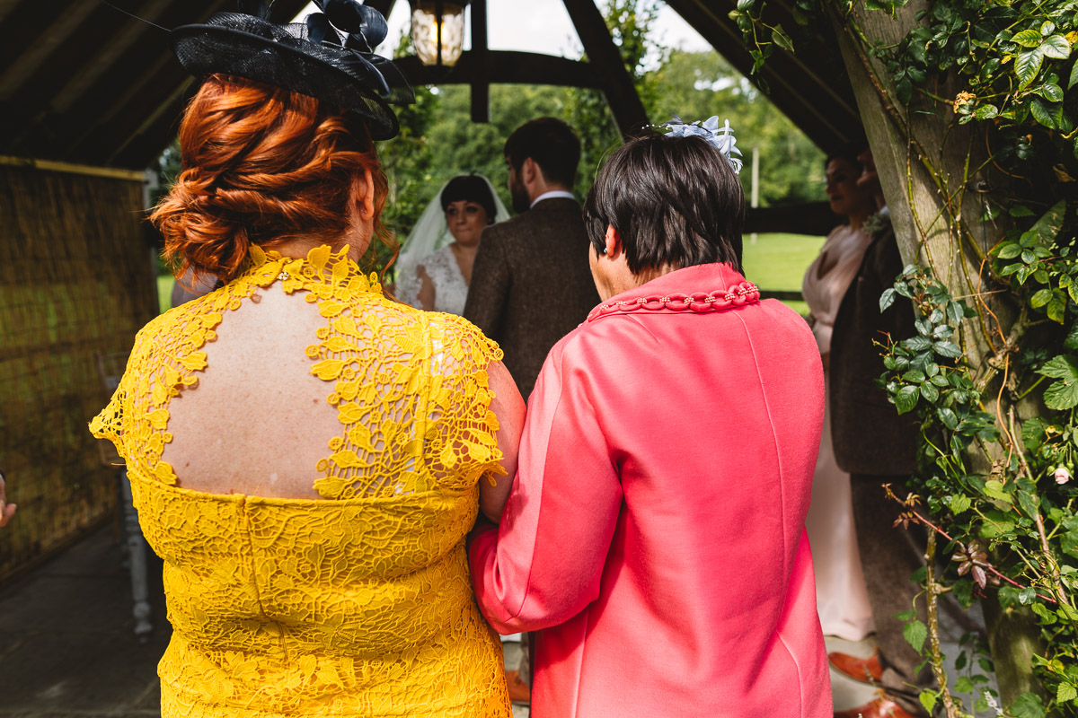 Mothers of the couple watch vows at hyde barn wedding