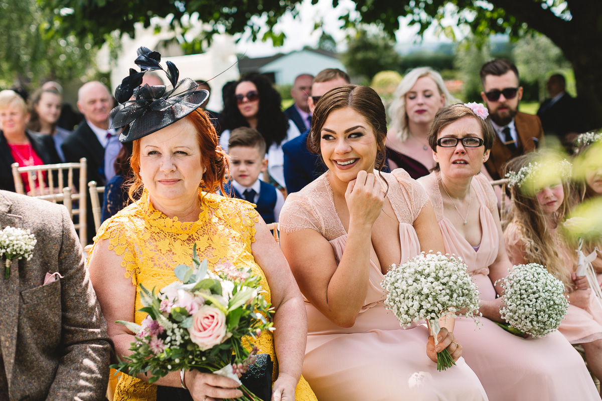 Natural candid photo of bridal party during Hyde Barn Wedding Ceremony
