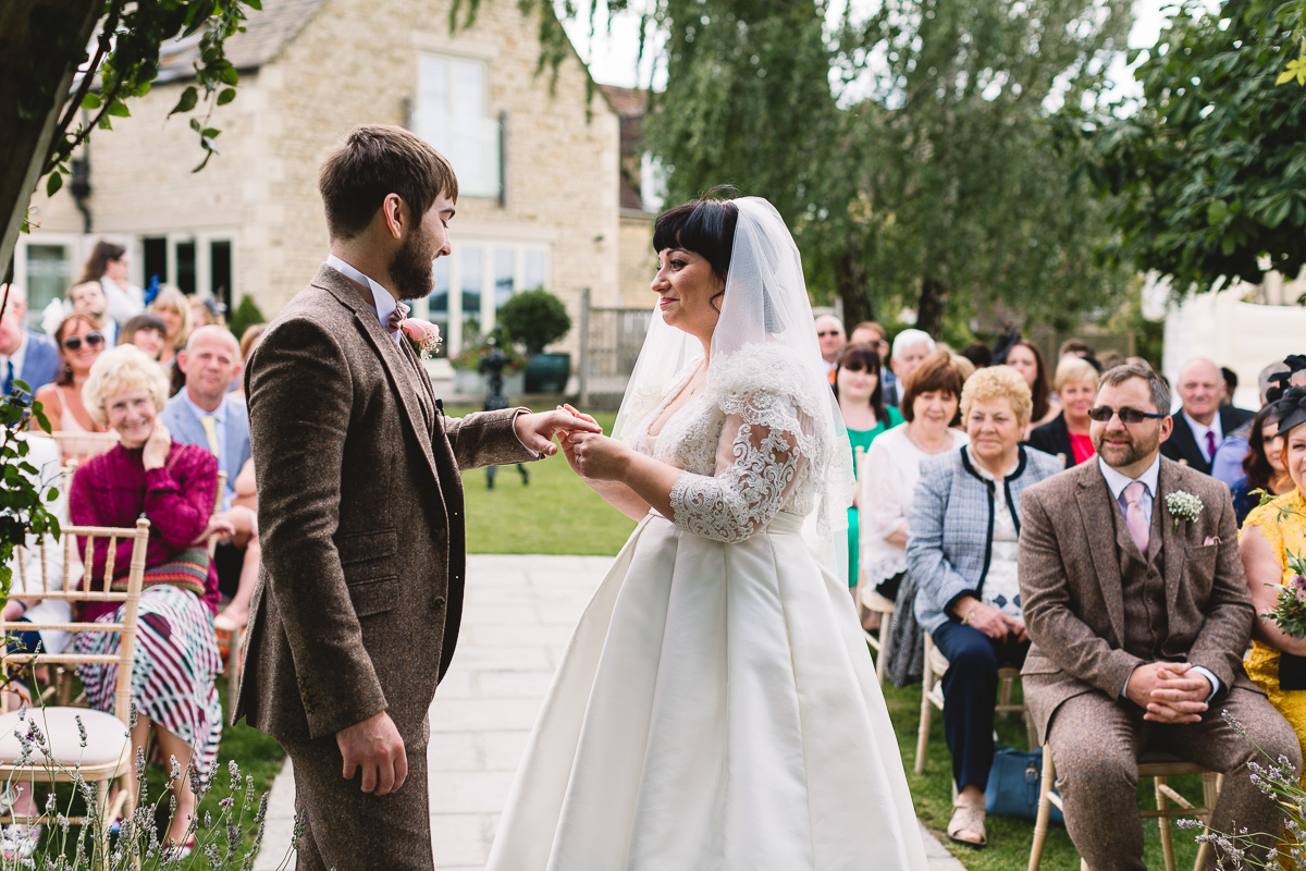 Ring exchange during relaxed Hyde Barn Wedding Ceremony