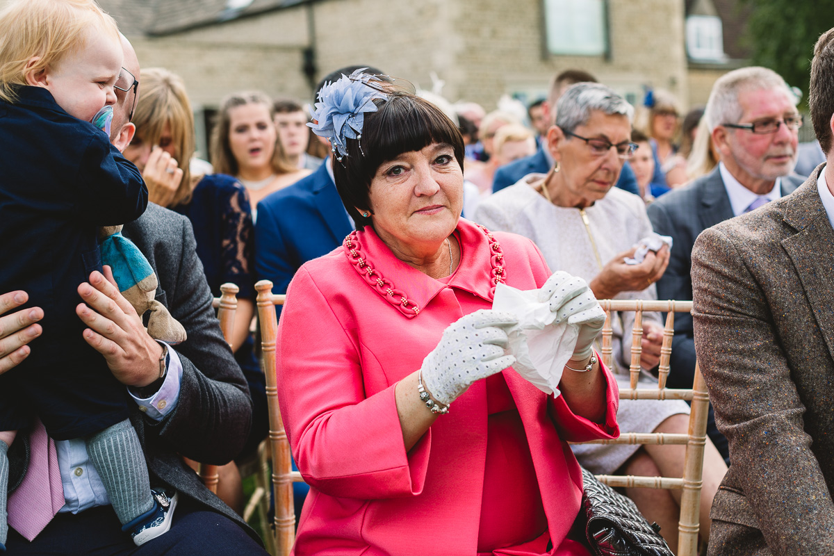 Mother of the groom sheds tear at outdoor wedding ceremony in the Cotswolds