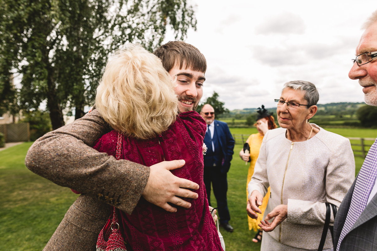 People hugging | natural candid moments at Hyde Barn Wedding