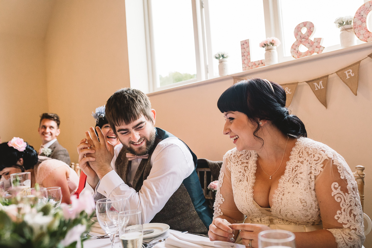 Groom smiles at Cotswolds wedding with rustic DIY touches